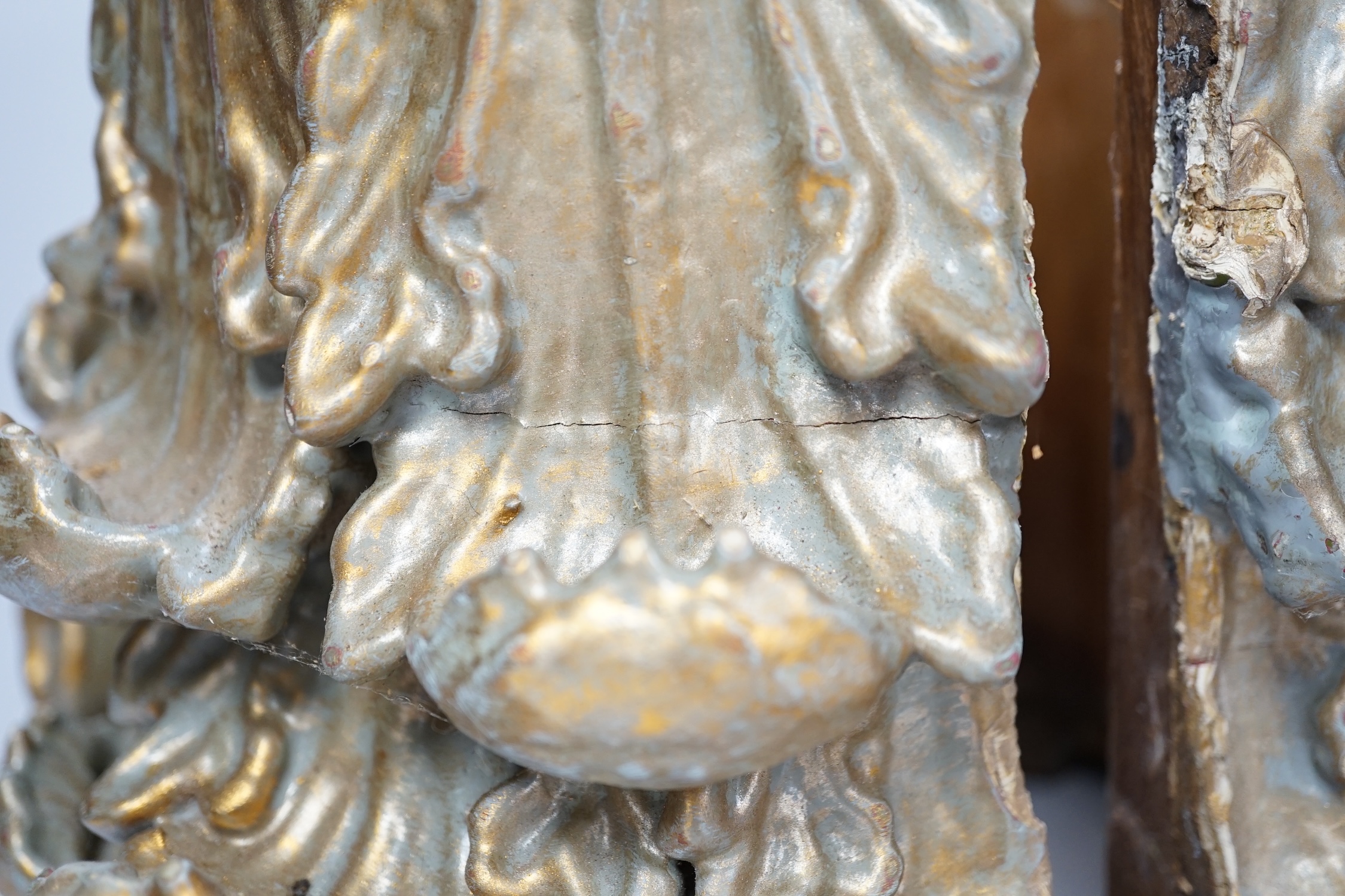 A carved wood and gesso gilt column base in two sections, 28cm high. Condition- fair
